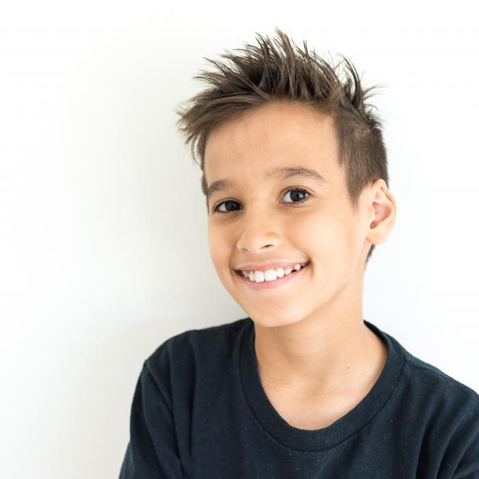 9 year old boy with black shirt and spiked hair