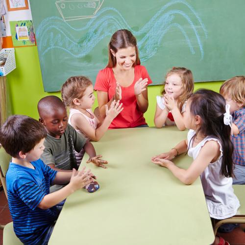 Teacher and classroom with young children