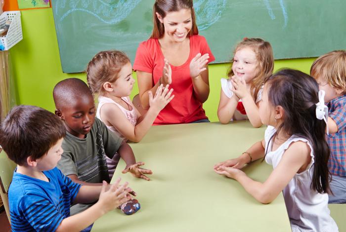 Teacher and classroom with young children