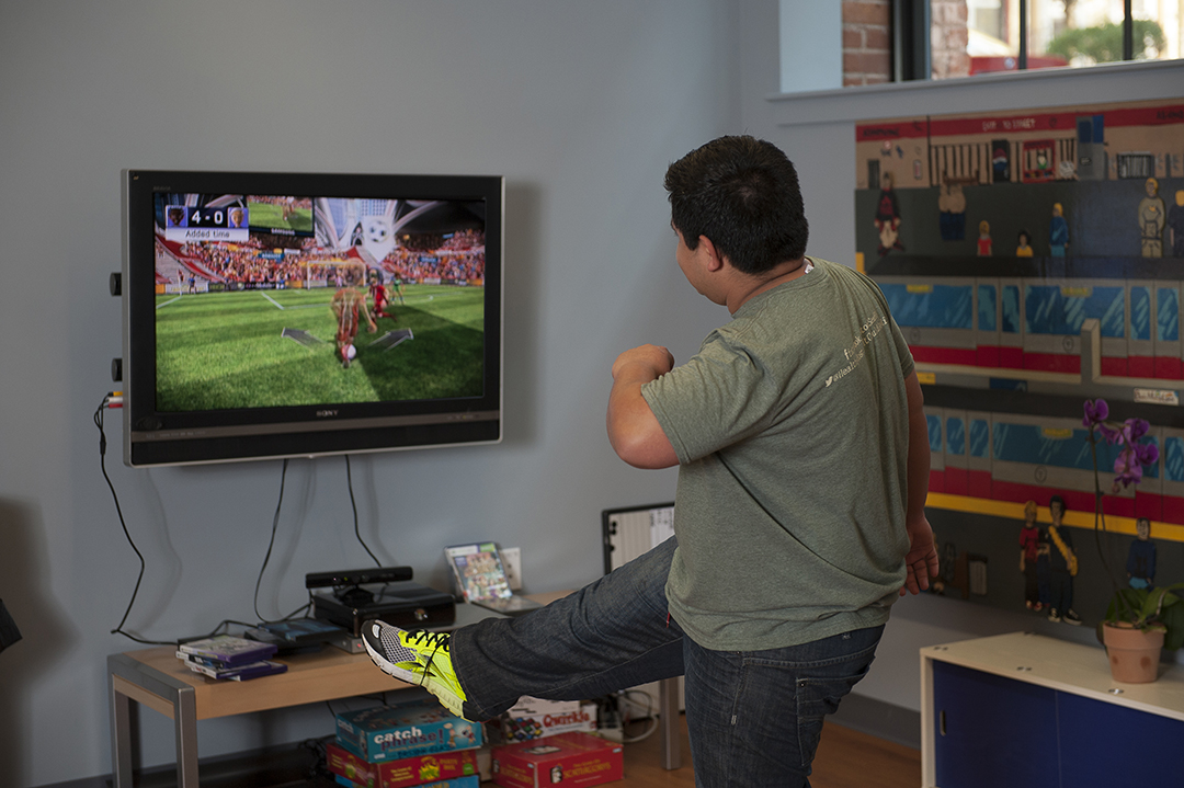 young adult playing a video game