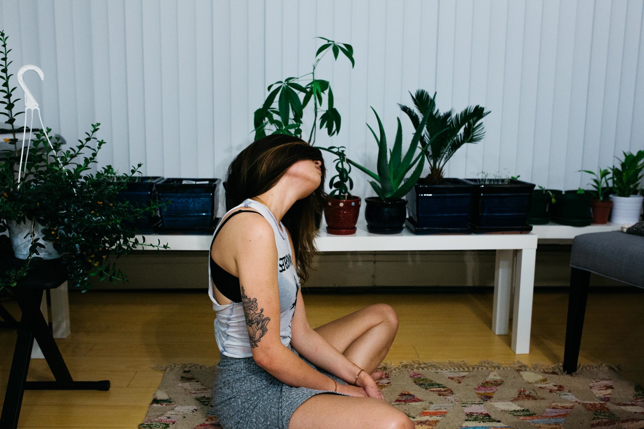 Woman sitting on floor meditating