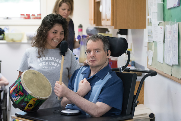 man with disability playing drum