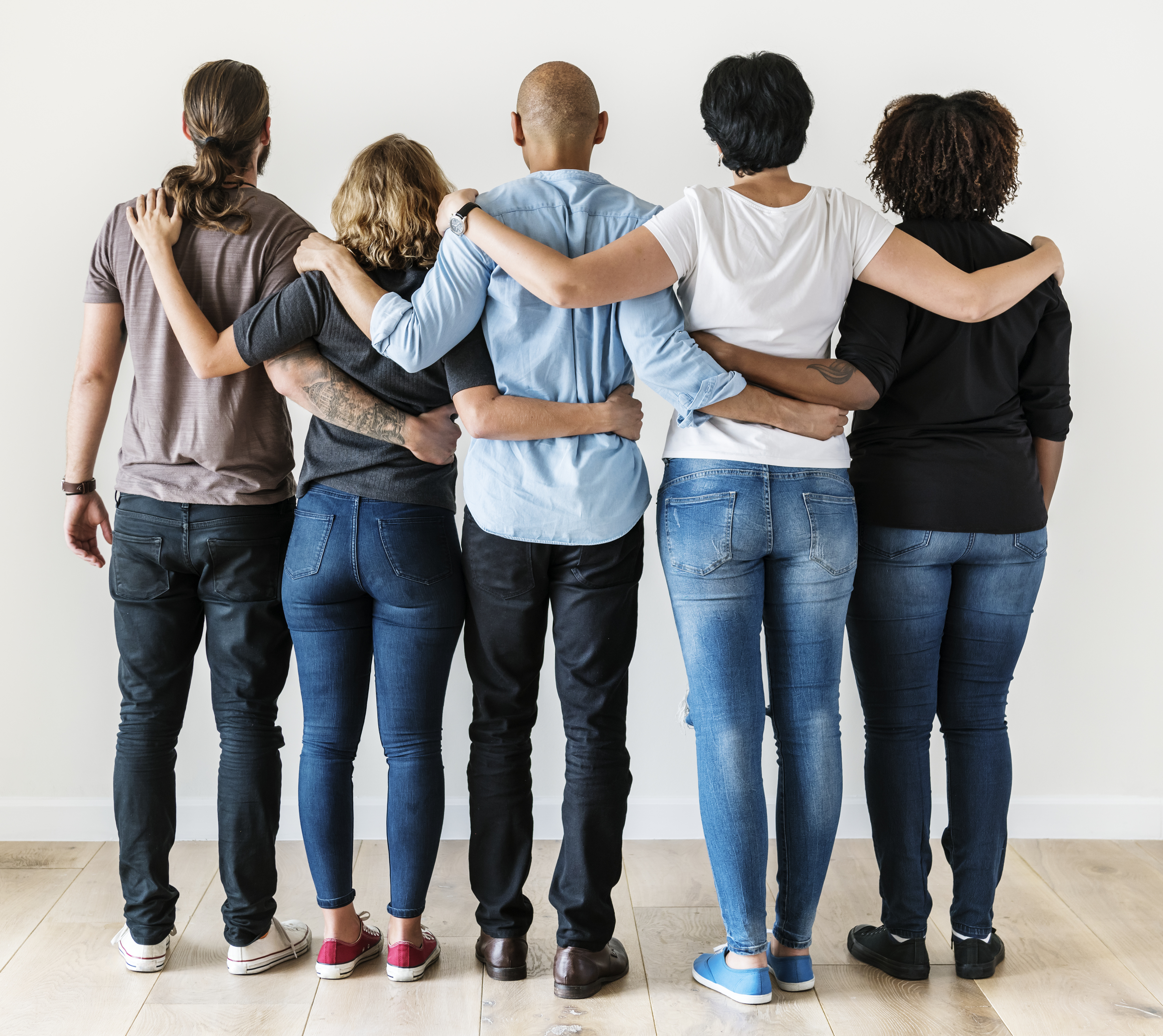 People with arms around each other