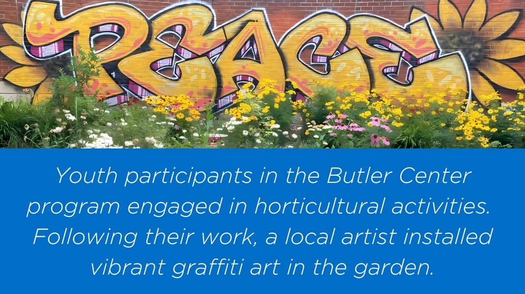 Youth participants in the Butler Center program engaged in horticultural activities. Following their work, a local artist installed vibrant graffiti art in the garden.