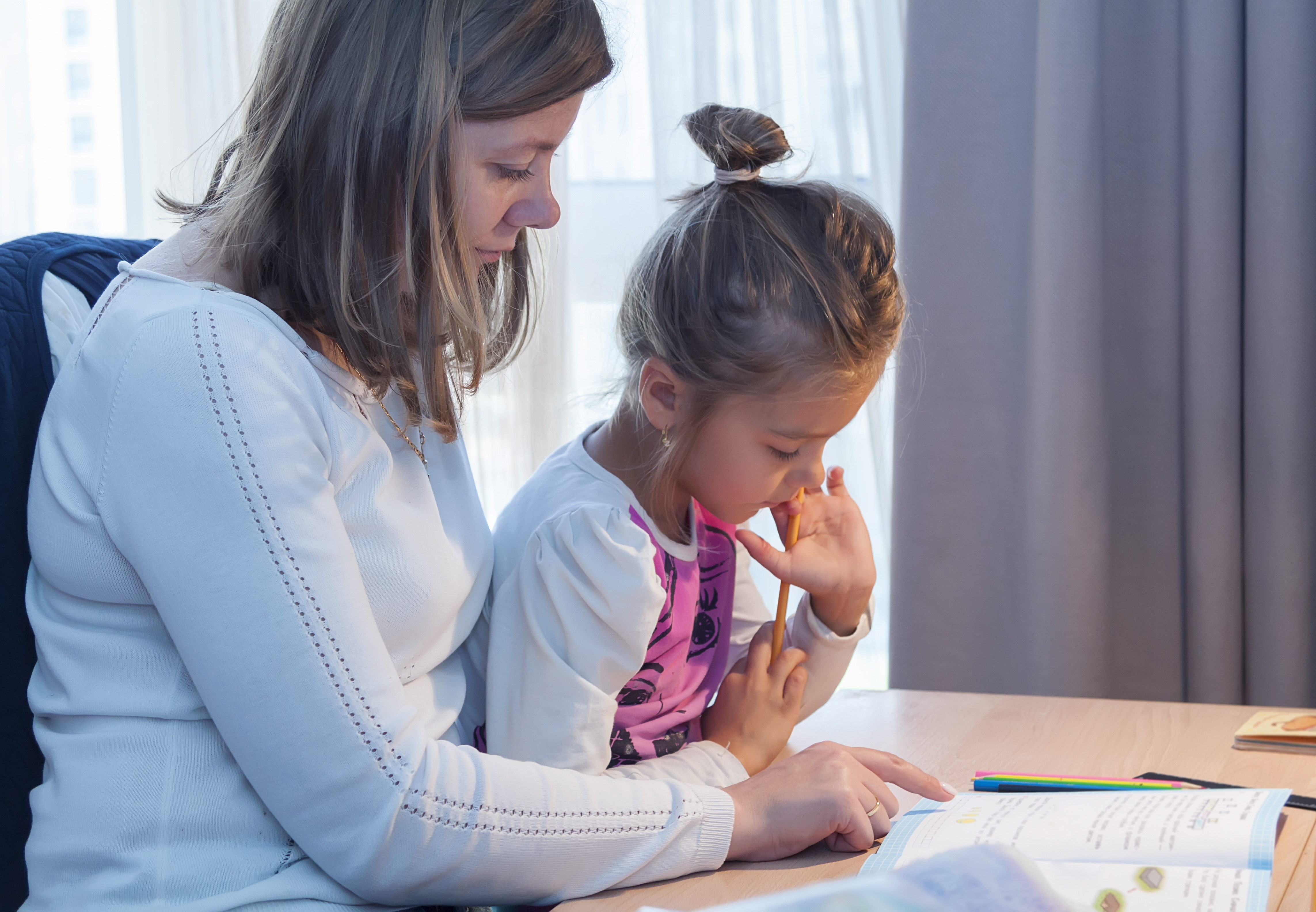 Foster Mother and Daughter doing remote learning