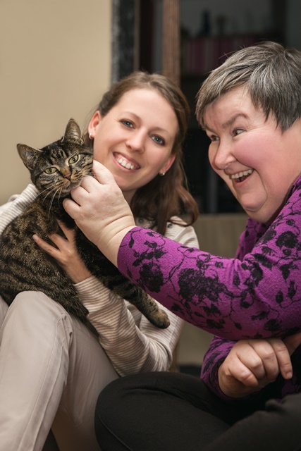 Two females and a cat