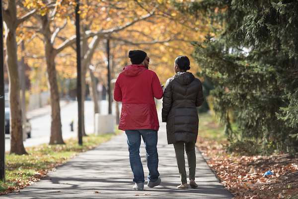 two peole walking and talking