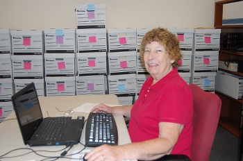 Diane sitting at computer