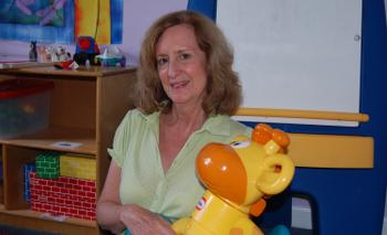 Nancy holding children's toy