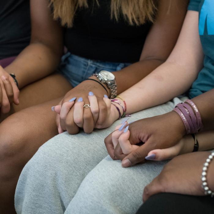 A group of girls holding hands
