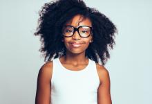 African American teen girl with glasses, white background