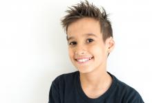 9 year old boy with black shirt and spiked hair