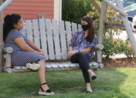 Student and Clinician on lawn swing