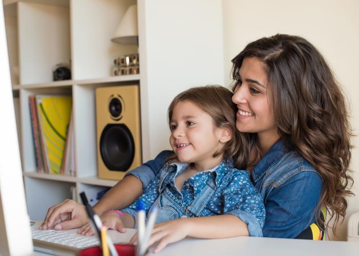 Mother and daughter looking at computer