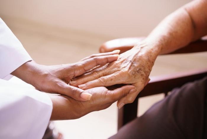 elderly hands and doctor hands