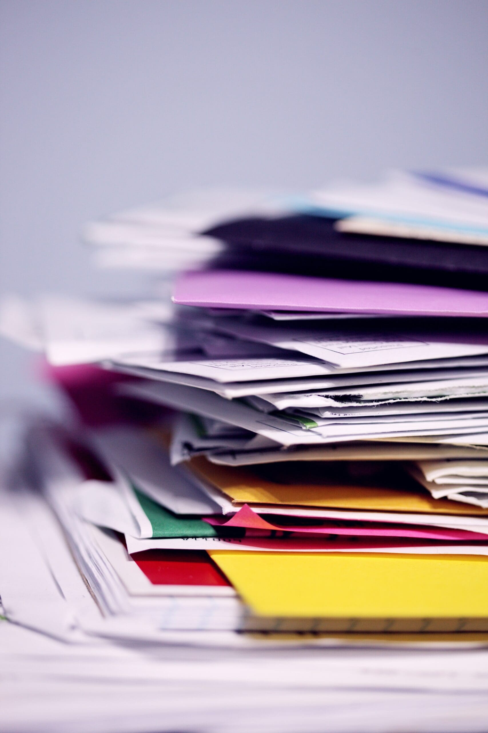 Stack of colorful papers and files.